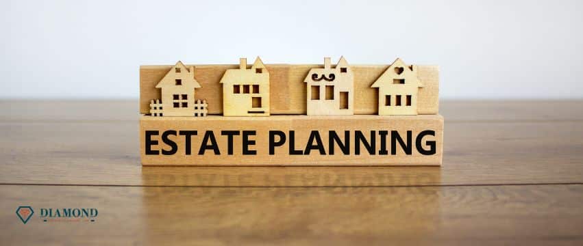 A wooden figure with houses on top of a sign that says "estate planning".