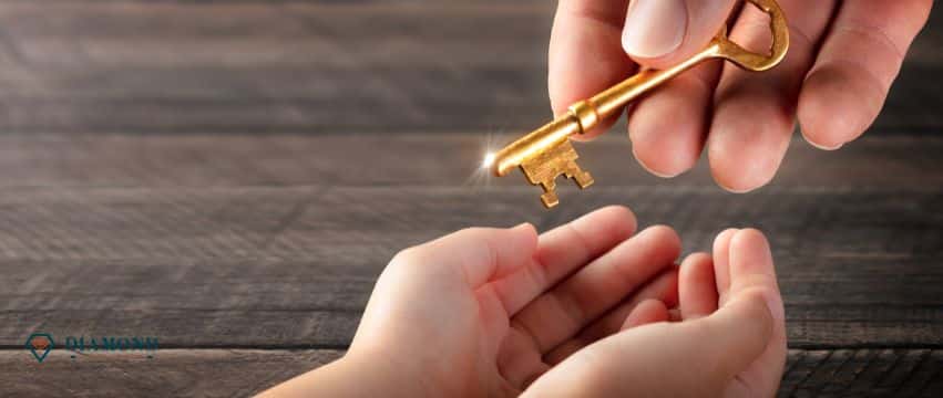 A parent handing a child a gold key.